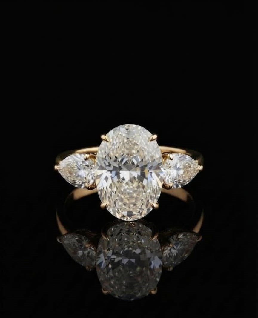 Discover our 5ct oval lab-grown diamond engagement ring featuring pear side stones set in 9K,14K & 18k yellow gold. Timeless, ethical luxury crafted for maximum brilliance. Shop now.
