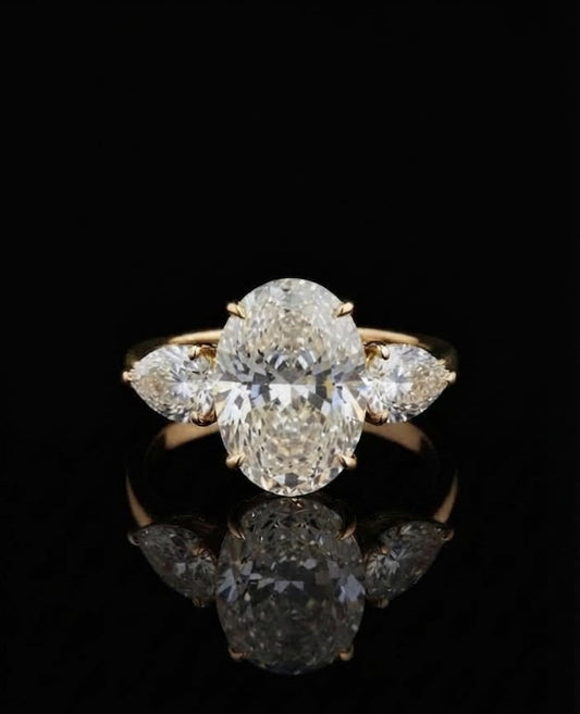Discover our 5ct oval lab-grown diamond engagement ring featuring pear side stones set in 9K,14K & 18k yellow gold. Timeless, ethical luxury crafted for maximum brilliance. Shop now.