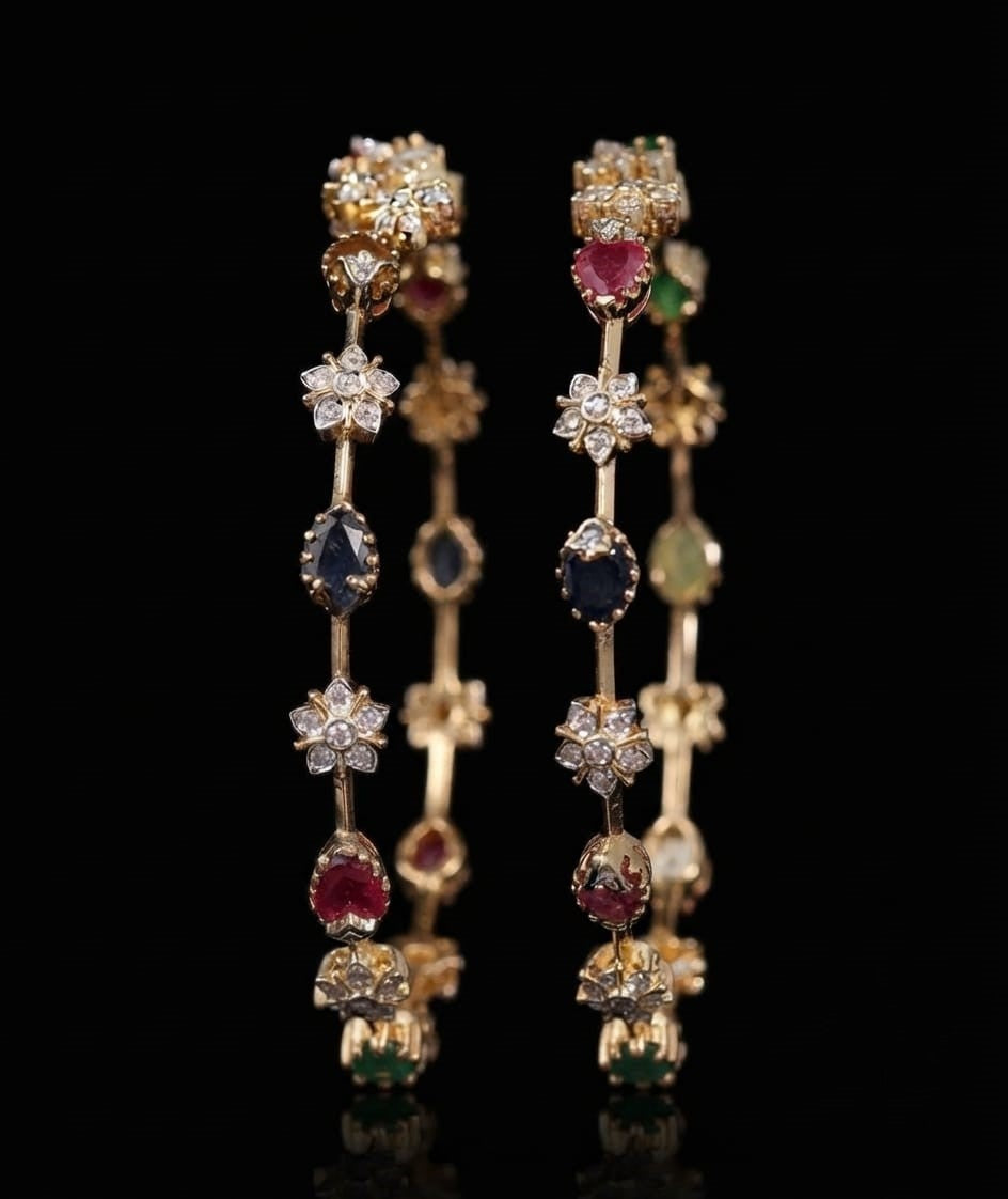 Pair of traditional gold bangles set with lab grown diamond cluster flowers and ruby, sapphire, and emerald gemstones