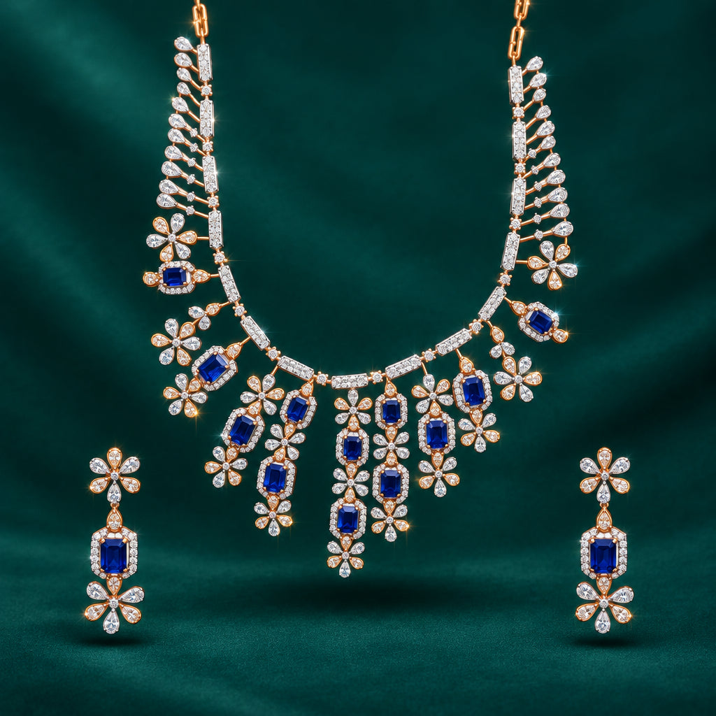 A necklace and earring set featuring freshwater sapphires and diamonds with a gold and silver color scheme.