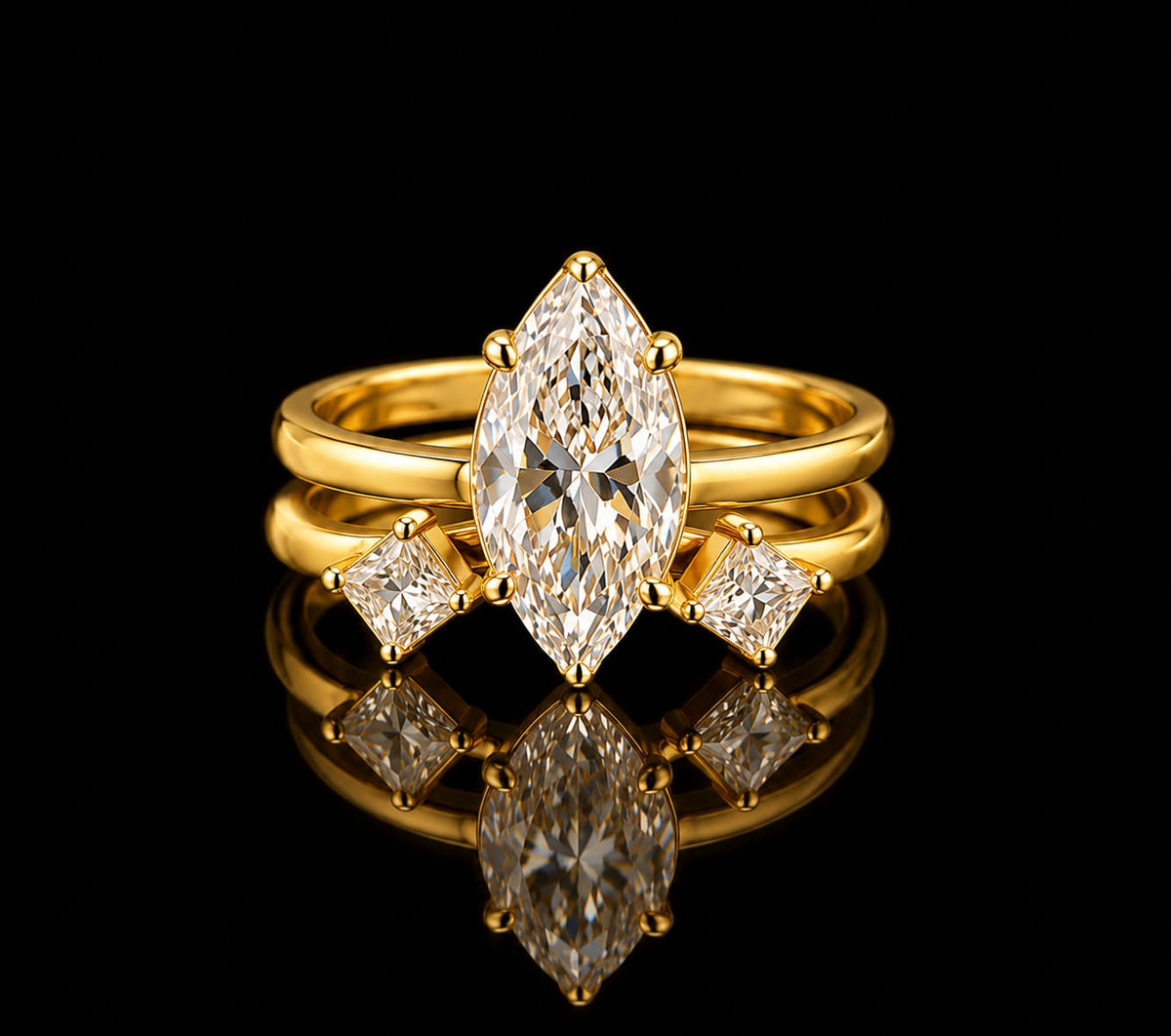 A striking combination of bold geometry and modern elegance. This two-piece ring set features a brilliant Marquise-cut solitaire solitaire paired with an open-cuff companion band set with Kite-cut accent stones, all finished in rich yellow gold.