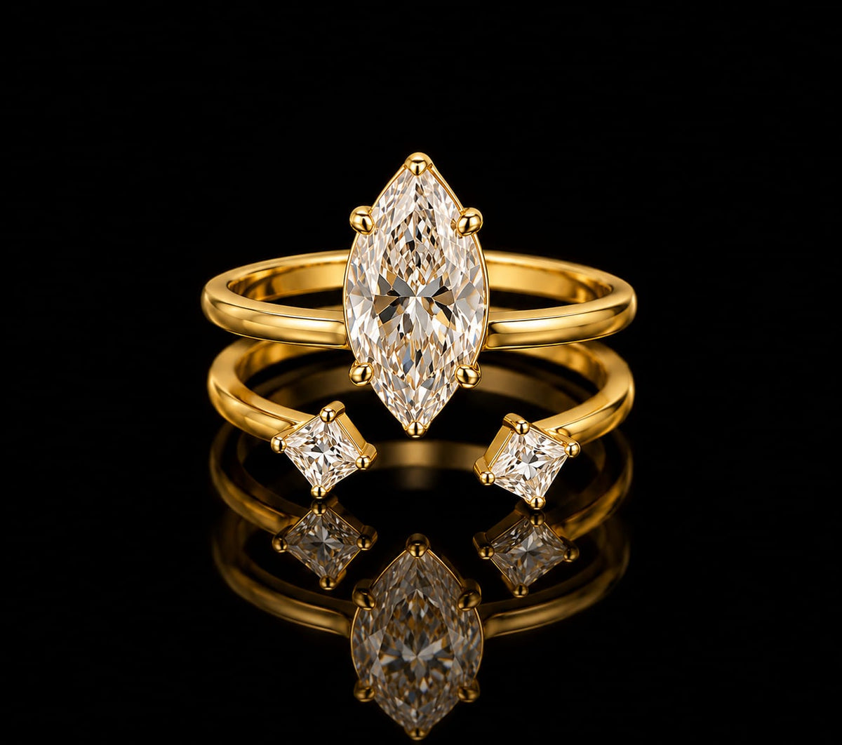 A gold ring set with a marquise-cut diamond center stone and two smaller Kite-cut diamond side stones, displayed on a reflective black surface.