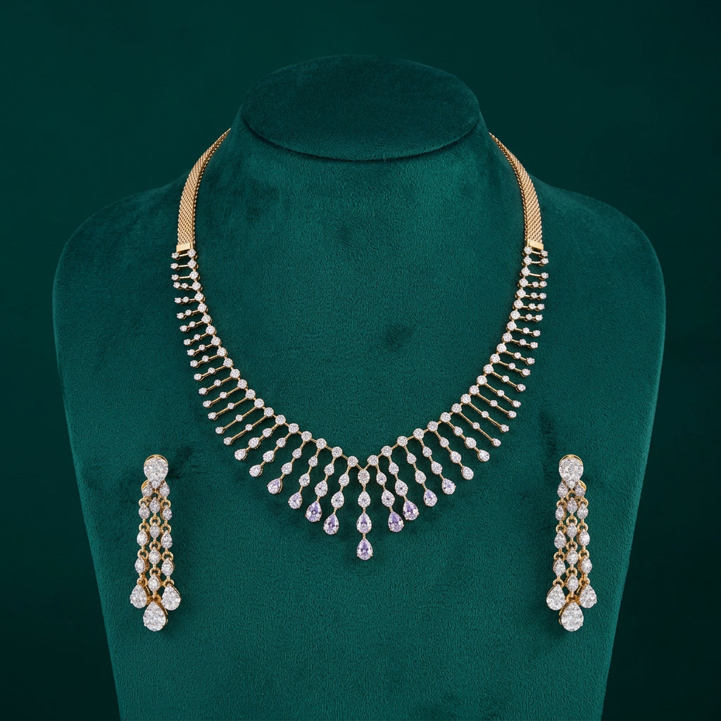 A diamond-studded necklace with a gold-colored clasp and a pair of matching earrings, both featuring a rain drop design.