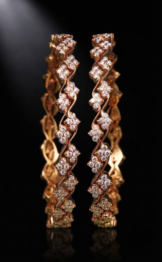 Pair of gold wavy bangles featuring four-stone floral cluster lab grown diamonds along a continuous zigzag frame in Lab grown diamond