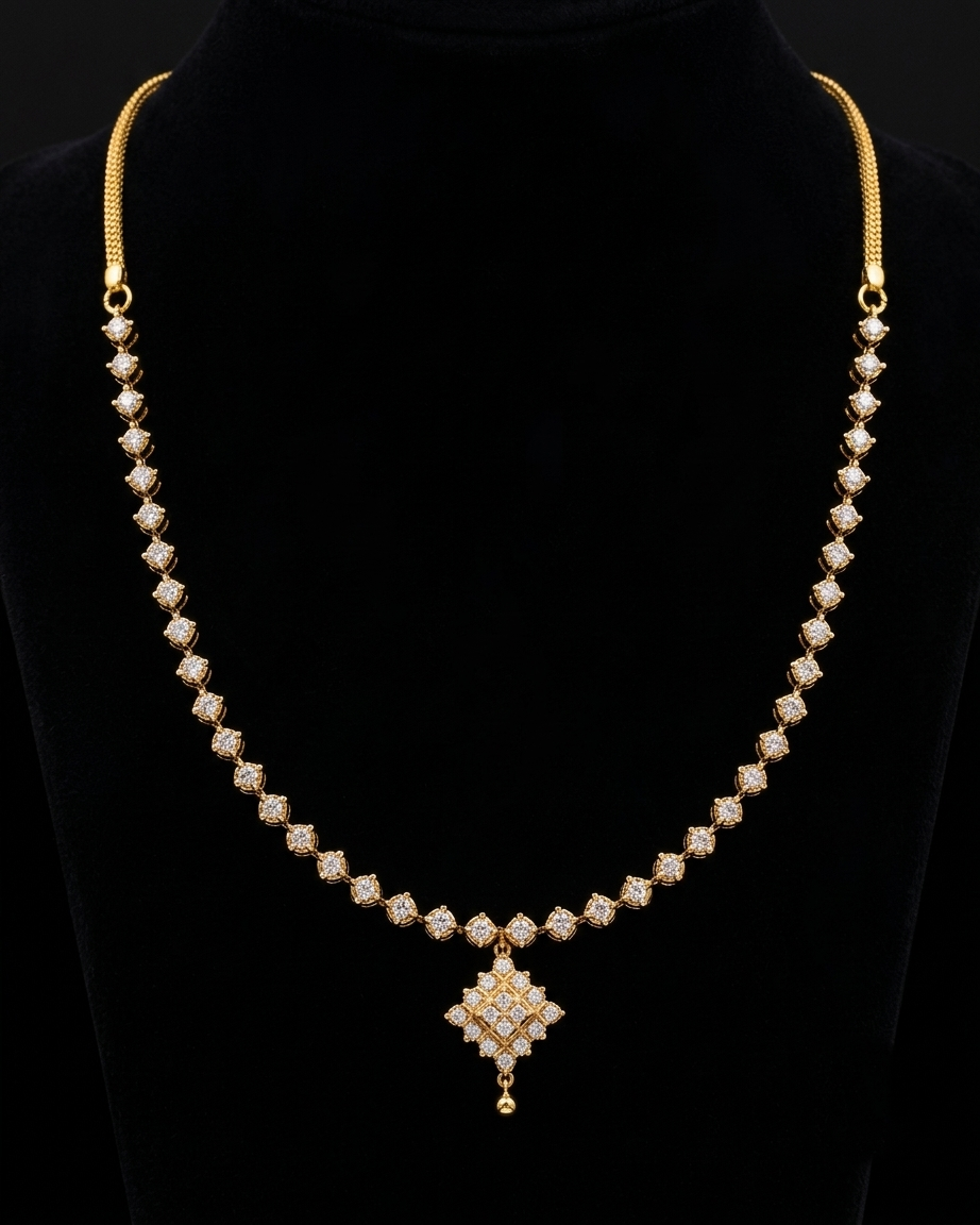 A 18KT yellow gold necklace with pavé-set clear stones, displayed on a black velvet jewelry bust. The necklace features a textured gold chain, a row of small diamond pointers, and a larger central pendant with a dangling charm.
