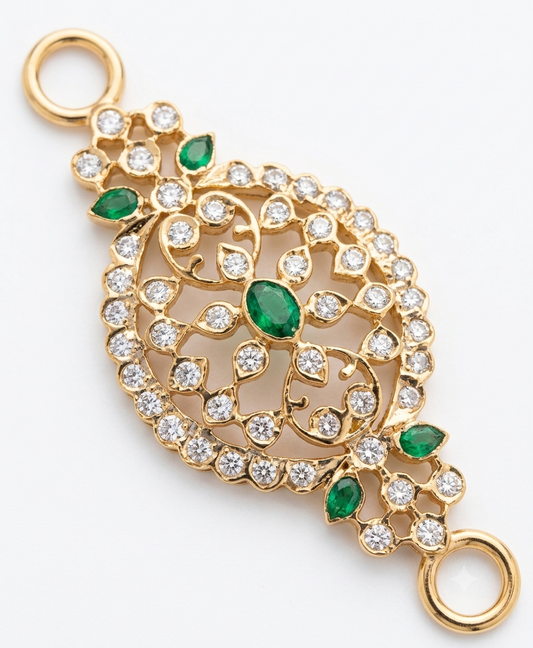 Gold filigree pendant with green emerald-cut gemstones and clear pavé-set round stones, shown on a white background.