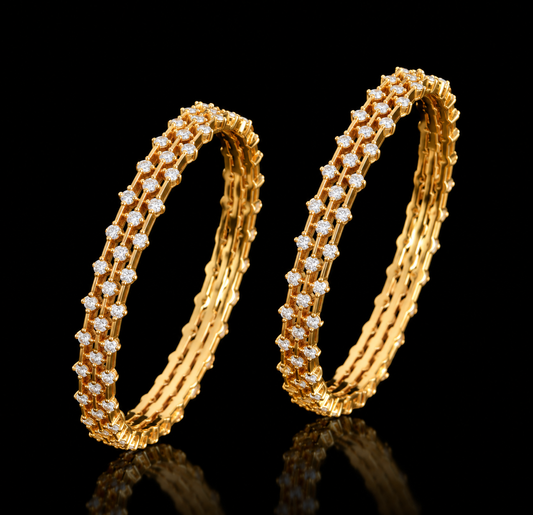 Pair of 18k gold bangles studded with a double layer of Lab grown diamonds in a traditional geometric openwork design